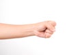 Hands clenched fists isolated on a white background. Close-up of female hand reaching out with a clenched fist Royalty Free Stock Photo