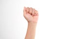 Hands clenched fists isolated on a white background. Close-up of female hand reaching out with a clenched fist Royalty Free Stock Photo