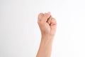 Hands clenched fists isolated on a white background. Close-up of female hand reaching out with a clenched fist Royalty Free Stock Photo