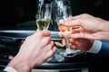 Hands clink glasses with champagne Royalty Free Stock Photo