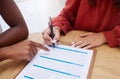 Hands, clipboard or contract and a business woman writing on a survey with her financial advisor in an office. Documents