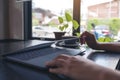 Hands close and open a laptop computer on table after finished using it Royalty Free Stock Photo