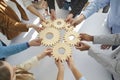 Multi-Ethnic business people connect gear together, success cooperation teamwork concept. Royalty Free Stock Photo