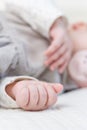 Hands closeup of baby girl sleeping over bedcover Royalty Free Stock Photo