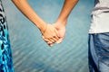 Hands closeup of a loving couple, romance, love, jeans. Concept idyll