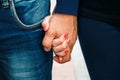 Hands closeup of a loving couple, romance, love, jeans. Concept idyll Royalty Free Stock Photo