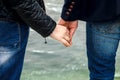 Hands closeup of a loving couple, romance, love, jeans. Concept idyll Royalty Free Stock Photo