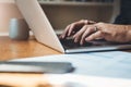 Hands, closeup and man with laptop in home office for finance, review or budget planning. Fingers, keyboard and male