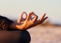 Hands closeup, yoga and beach with woman, lotus and peace of mind in summer sunshine on sand. Girl, zen meditation and