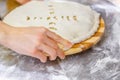 Hands closing the Ossetian pie stuffed with minced meat Royalty Free Stock Photo