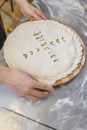 Hands closing the Ossetian pie stuffed with minced meat Royalty Free Stock Photo