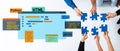 Hands Collaborating Over Puzzle Pieces Representing Different Programming Languages with a Digital Interface Background Royalty Free Stock Photo