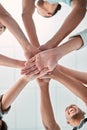 Hands, collaboration and unity with a business team in a huddle or circle in the office together from below. Meeting Royalty Free Stock Photo