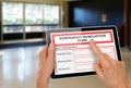 Hands with Computer Tablet and Emergency Evacuation Plan by Doors Royalty Free Stock Photo