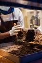 A hands of confectioner-chocolatier during at work. The making of cake Royalty Free Stock Photo