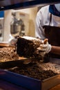 A hands of confectioner-chocolatier during at work. The making of cake Royalty Free Stock Photo