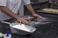 Hands of confectioner preparing dough for sweet pie Royalty Free Stock Photo