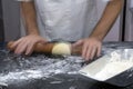 Hands of confectioner preparing dough for sweet pie Royalty Free Stock Photo