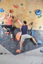 Hands Connected Happy One Joyful couple While Bouldering Or Wall Climbing up Together in Gym Royalty Free Stock Photo