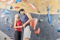 Hands Connected Happy One Joyful couple While Bouldering Or Wall Climbing up Together in Gym Royalty Free Stock Photo