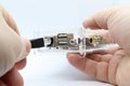 Hands connecting a computer network cable to a mini PC Royalty Free Stock Photo