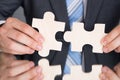 Hands connecting puzzle pices Royalty Free Stock Photo