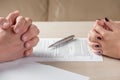 Hands of contractual parties, a woman and a man, signing a contract Royalty Free Stock Photo