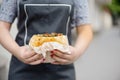 In the hands of the cook, falafel and fresh vegetables in pita b