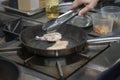 Hands cook, fry in a frying pan chicken Royalty Free Stock Photo