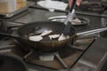 Hands cook, fry in a frying pan chicken Royalty Free Stock Photo