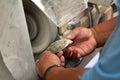 Hands of a Cook Islander man polishing Tahitian Black Pearl she Royalty Free Stock Photo