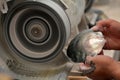 Hands of a Cook Islander man polishing Tahitian Black Pearl she Royalty Free Stock Photo