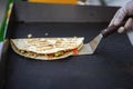 Hands of cook preparing fajita wrap with beef, chicken and vegetable salad. Mexican food. Party food Royalty Free Stock Photo