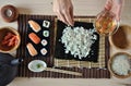 Hands cooking sushi