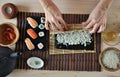 Hands cooking sushi