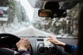 Hands of couple driving and using navigation on mobile phone Royalty Free Stock Photo