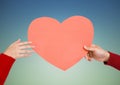 Hands of couple holding a heart Royalty Free Stock Photo