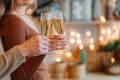 hands couple in love with glasses of champagne in christmas's kitchen. romantic. Royalty Free Stock Photo