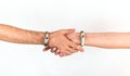 Hands of a couple of man and woman touching each other, wearing luxurious jade bracelets