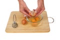 Hands cracking eggs