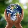 Hands cradle Earth gently, symbolizing importance of environmental stewardship and interconnectedness of all life