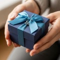The hands cradling the box suggest careful handling and possibly a gift Royalty Free Stock Photo