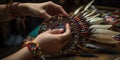 Hands craft a traditional native american headdress, adorned with a colorful array of feathers and beads, concept of