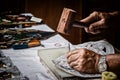 Hands of craftsman carve with a gouge. Activity, antique. Royalty Free Stock Photo