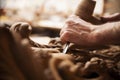 Hands of craftsman carve with a gouge Royalty Free Stock Photo