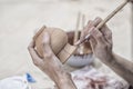 Hands of craftspeople painting a clay pot Royalty Free Stock Photo