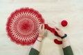 Hands of a craftswoman with a ball of red threads. Unusual hobby crochet. Background with copy space Royalty Free Stock Photo