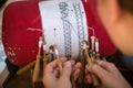 Hands of craftswoman making bobbin lace Royalty Free Stock Photo