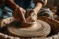Hands create a pottery bowl on a wheel in a workshop surrounded by tools and clay Royalty Free Stock Photo