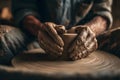 Hands create a pottery bowl on a wheel in a workshop surrounded by tools and clay Royalty Free Stock Photo